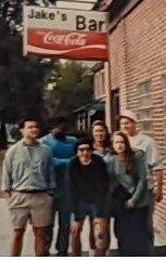 A group of people standing outside a building

Description automatically generated with medium confidence